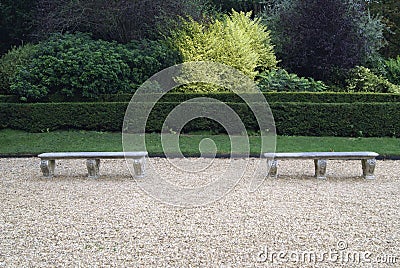 Sculptured stone seats in a garden Stock Photo