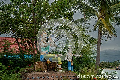 Sculptures of ancient mystical creatures at the bank of river in Thailand. Stock Photo