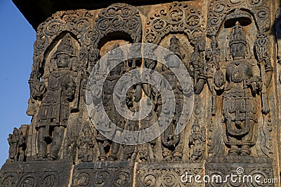 Sculptures and Friezes on the outer walls of Hoysaleswara Temple at Halebidu , Karnataka, India Stock Photo