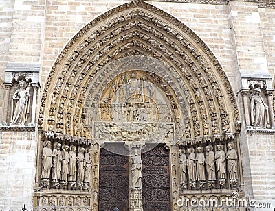 Sculptures at main entrance to cathedral Notre Dame de Paris. Notre Dame-famous Gothic, Roman Catholic cathedral in Paris, France Stock Photo