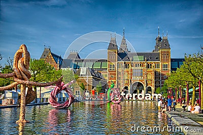 Sculptures in water near Rijksmuseum Amsterdam museum in Holland Editorial Stock Photo