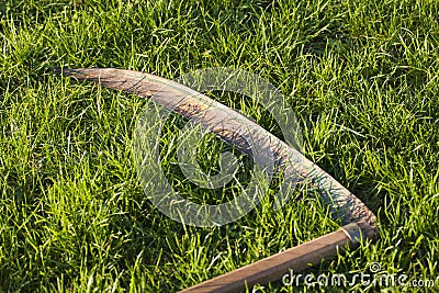 Scythe in grass Stock Photo