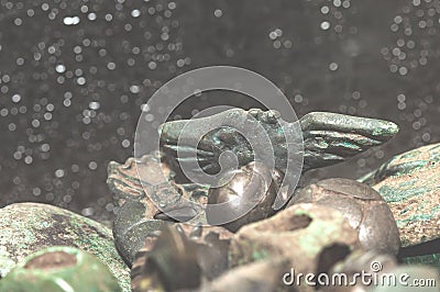 Soft focus Scythian Nanosnik on defocused background many ancient Scythian items Stock Photo