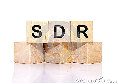 SDR text on wooden cubes on a white background Stock Photo