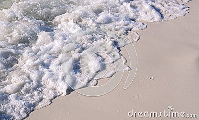 Sea beach with foamy wave photo background. Coral beach sand with sea tide. White sand of oceanic coastline Stock Photo