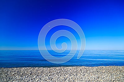 The deep blue sky of the sea shore stones Stock Photo