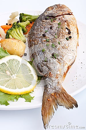 Sea Bream fish with vegetables Stock Photo