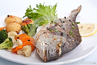 Sea Bream fish with vegetables Stock Photo