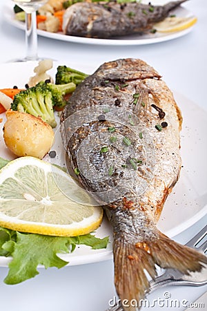 Sea Bream fish with vegetables Stock Photo