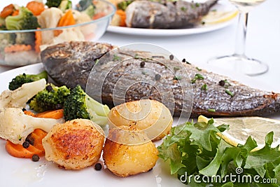 Sea Bream fish with vegetables Stock Photo