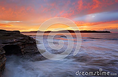 Sea Cave at Sunrise Stock Photo