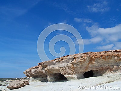 Sea caves and blue sky Stock Photo