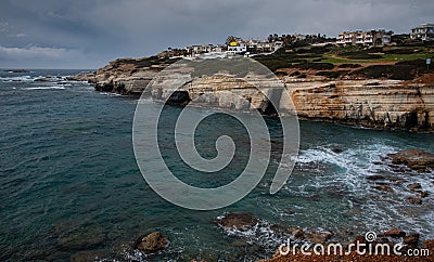 Sea caves on the rocky coast of Peyia village at Paphos District in Cyprus Stock Photo