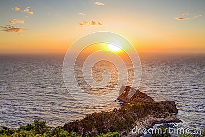 Sea coast at sunset, Bright sun on sky. Mallorca, Spain. Stock Photo