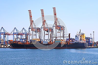 Sea container ship loading at the container terminal in the Odessa seaport. Ships, transport in sea port. Odesa, Ukraine Stock Photo