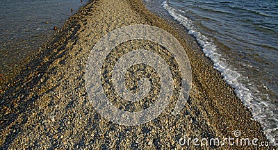 In the sea filled the road to the lighthouse, in the middle of the Sea Beach line passes Stock Photo