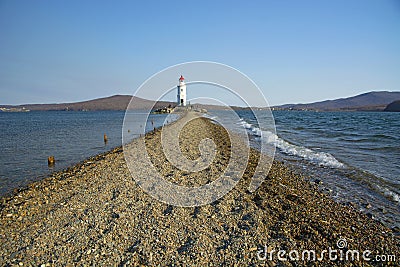 In the sea filled the road to the lighthouse, in the middle of the Sea Beach line passes Stock Photo