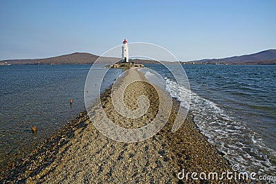 In the sea filled the road to the lighthouse, in the middle of the Sea Beach line passes Stock Photo