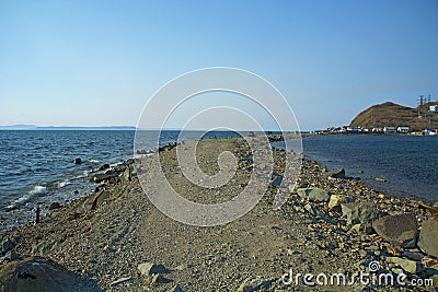 In the sea filled the road to the lighthouse, in the middle of the Sea Beach line passes Stock Photo