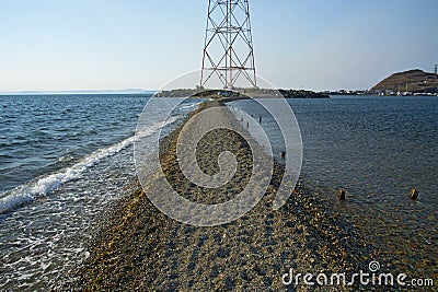 In the sea filled the road to the lighthouse, in the middle of the Sea Beach line passes Stock Photo