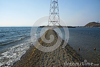 In the sea filled the road to the lighthouse, in the middle of the Sea Beach line passes Stock Photo