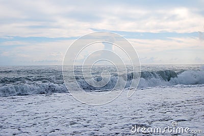 Sea foam waves, sunset on the sea, clouds over the waves in the sea, storm on the sea Stock Photo