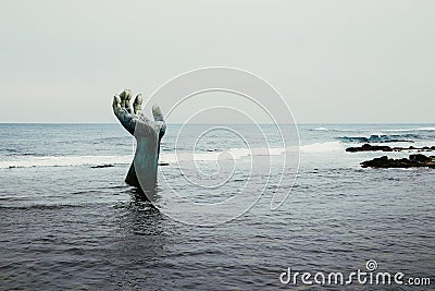 Sea and hand sculpture at Homigot in Pohang, Korea Editorial Stock Photo