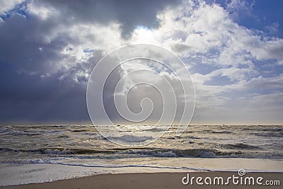 Sea landscape with huge waves and a lightbeam in Sylt Stock Photo