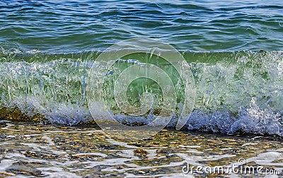 Sea/ocean wave breaking at the beach Stock Photo