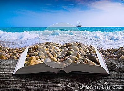 Sea with pebble beach on the pages of book Stock Photo