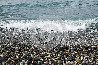 Sea pebbles and waves Stock Photo