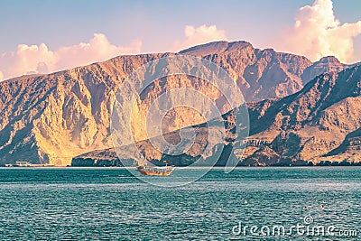 Sea, pleasure boats, rocky shores in the fjords of the Gulf of Oman Stock Photo