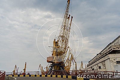 Sea port with yellow working cranes in Ukraine Stock Photo