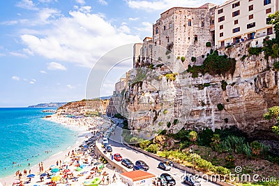 Sea promenade scenery in Tropea with high cliffs with built on top city buildings and apartments. Rotonda beach full of people. Editorial Stock Photo