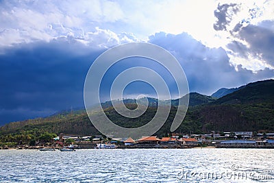 Sea Ripple under Sunlight Town at Island Hill Clouds Shadows Stock Photo