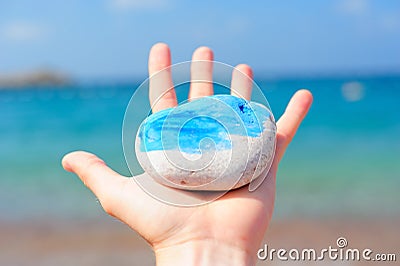 Sea rock in a hand Stock Photo