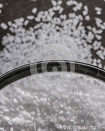 Sea Salt in Glass Bowl with Spill Over Stock Photo