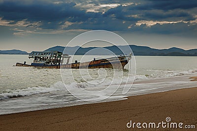 Sea scape of wreck boat on beach Stock Photo