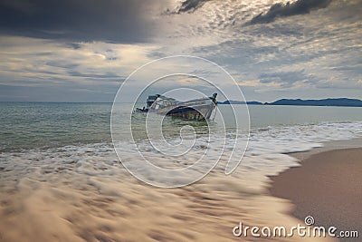 Sea scape of wreck boat on sea beach Stock Photo