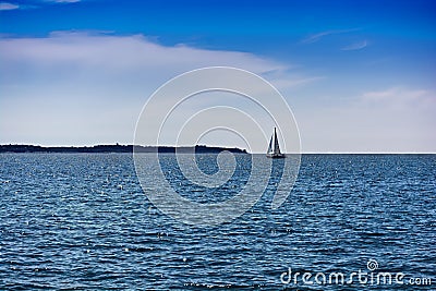 Sea scenery with a blue waves and yacht Stock Photo