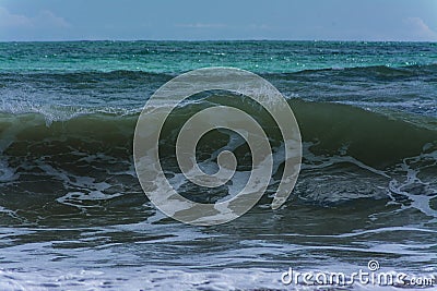 Wave near the beach a windy day Stock Photo