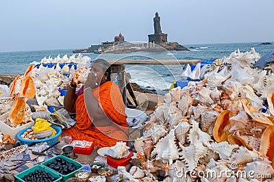 Sea shell seller with background view of Vivekananda Memorial Rock, in Kanyakumari, Tamilnadu Editorial Stock Photo