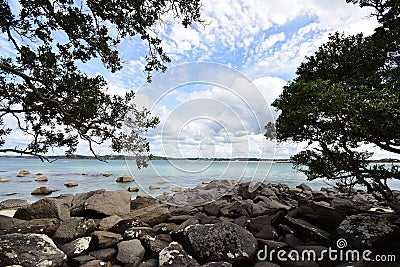 Sea shore with large boulders Stock Photo