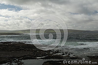 Sea side with irish coast Stock Photo