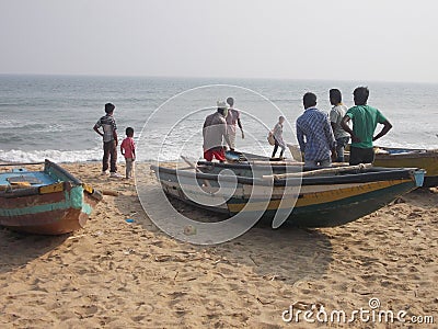 Sea side village people boats Editorial Stock Photo