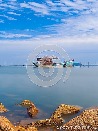 sea , sky and wreck fishing boat Stock Photo