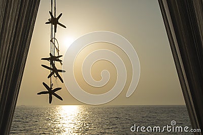 Sea stars decoration hanging from the white baldachin with beaut Stock Photo