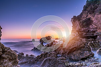 Sea sunset. Sea scape with rocks, long exposure Stock Photo