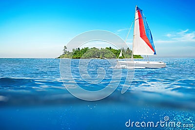 Sea surface summer wave background with sailboat. Stock Photo