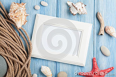 Sea vacation with blank photo frame, star fish and marine rope Stock Photo